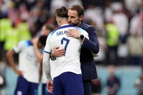 Jack Grealish and Gareth Southgate, Head Coach of England, look dejected after their sides' elimination from the tournament during the FIFA World Cup Qatar 2022 quarter final match between England and France at Al Bayt Stadium on December 10, 2022 in Al Khor, Qatar. (Photo by Elsa/Getty Images)