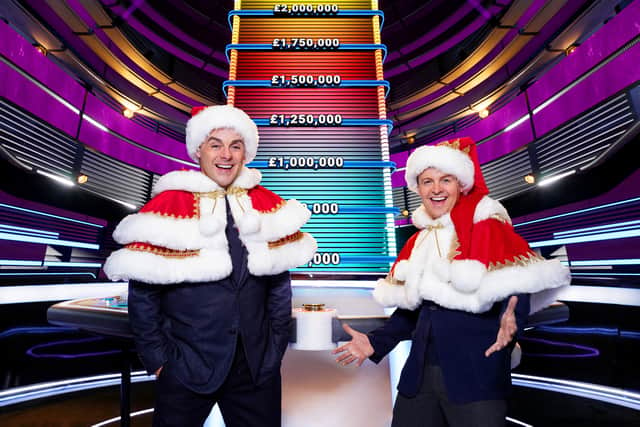Ant and Dec, wearing Santa hats, in front of the Limitless Win ladder (Credit: ITV)