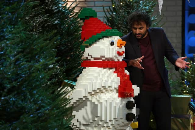 Nish Kumar, speaking conspiratorially to a Lego Snowman on Celebrity Lego Masters Christmas Special (Credit: Channel 4)