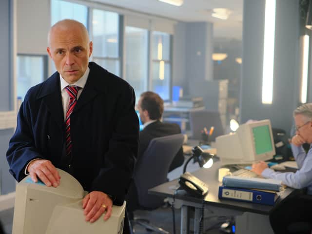 Mark Bonnar as DS Clive Timmons in Litvinenko, leaning on a hefty 2006 desktop computer (Credit: ITVX)