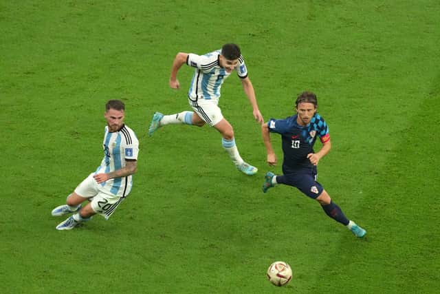 Argentina’s Alexis Mac Allister,Julian Alvarez and Croatia’s Luka Modric (left-right) in action (PA)