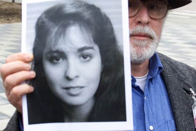 Daniel Cohen of the USA, holds a portrait of his 20-year old daughter Theodora who died on Pan Am Flight 103.