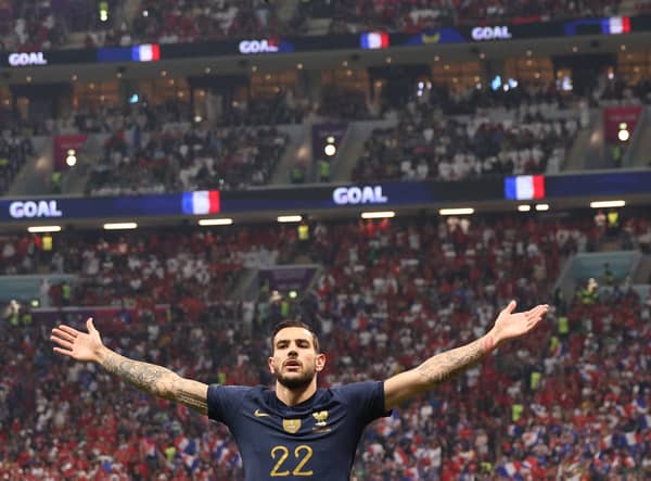 Theo Hernandez celebrates scoring France’s’s first goal during the World Cup semi-final meeting with Morocco  (Photo by ADRIAN DENNIS/AFP via Getty Images)