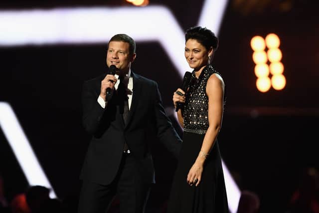 Dermot O'Leary and Emma Willis speak on stage at The BRIT Awards 2017 at The O2 Arena on February 22, 2017 in London, England. (Photo by Gareth Cattermole/Getty Images)