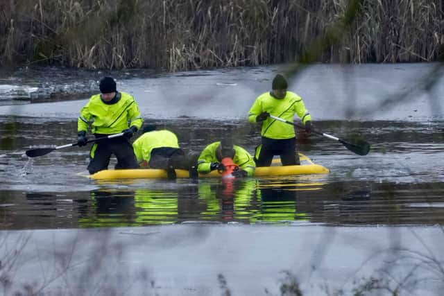 Emergency workers continue the search for further victims after a number of children fell through ice on a lake, on December 12, 2022 at Babbs Mill Park in Solihull, England. Credit: Christopher Furlong/Getty Images
