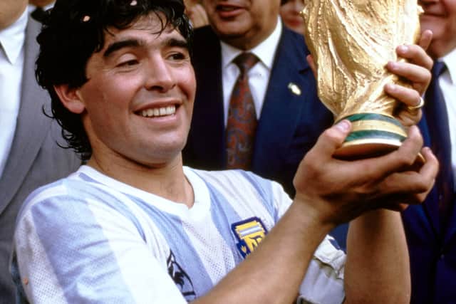 Argentina captain Diego Maradona holds aloft the trophy after the FIFA 1986 World Cup  final match (Getty Images)