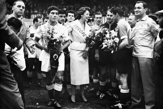 Miss Europe 1954 Christel Schaack congratulates Football players of West Germany after winning against Turkey during the FIFA World Cup (Getty Images)