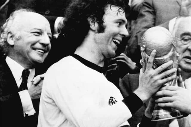 Germany’s star and team captain Franz Beckenbauer receives the World  Cup won by his team after a 2-1 victory over Holland. (Getty Images) 