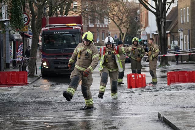 Emergency services on Belsize Road in Camden after a burst water main flooded the London street. London Fire Brigade (LFB) said eight fire engines and around 60 firefighters were called to Belsize Road at 2.50am on Saturday morning after a 42-inch water main burst, causing flooding to a depth of half a metre across an area of around 800 metres. Picture date: Saturday December 17, 2022.