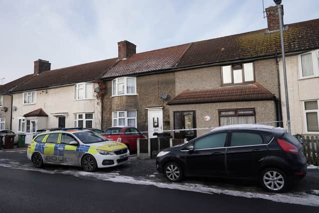 A police cordon on Maxey Road in Dagenham, east London, near to the scene where the bodies of two boys, aged two and five were found. A man and a woman were arrested following the discovery. Picture date: Saturday December 17, 2022.
