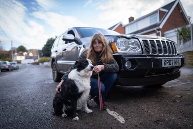 Sue Brewer and her dog Freya who drove the family jeep into their neighbours car. See SWNS story SWSYcrash; The border collie who crashed a Jeep into a parked car is still a “very good dog”, her family say. But her naughty antics mean she will be no longer get to ride upfront - and will be banished to the boot for future trips. Sue Brewer, 60, says pet pooch Freya was “absolutely fine” after the smash earlier this month. Doorbell footage released this week showed the six-year-old at the wheel of a 4x4. Sue said Freya, her daughter’s dog, jumped into the front seat and knocked the automatic gearbox into ‘drive’ - sending the vehicle down the hill.