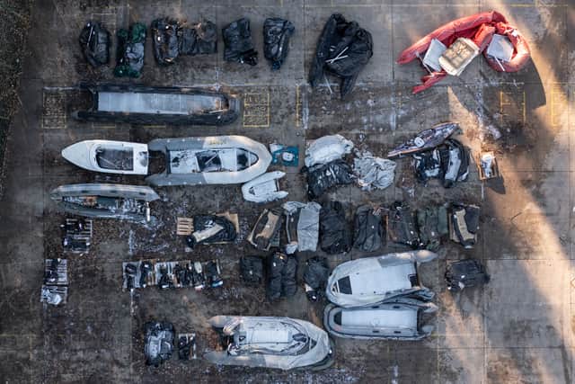DOVER, ENGLAND - DECEMBER 15: Inflatable craft and boat engines used by migrants to cross the channel are stored in a Home Office facility on December 15, 2022 in Dover, England. Four people died, and 39 were rescued, after a packed boat with migrants sank in the English Channel yesterday. A search continues for four more people believed to be missing. (Photo by Dan Kitwood/Getty Images)