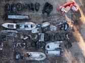 DOVER, ENGLAND - DECEMBER 15: Inflatable craft and boat engines used by migrants to cross the channel are stored in a Home Office facility on December 15, 2022 in Dover, England. Four people died, and 39 were rescued, after a packed boat with migrants sank in the English Channel yesterday. A search continues for four more people believed to be missing. (Photo by Dan Kitwood/Getty Images)
