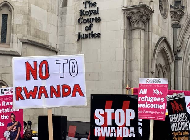 <p>Demonstrators outside the Royal Courts of Justice, central London, protesting against the government’s plan to send some asylum seekers to Rwanda. Credit: PA</p>