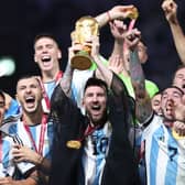 Lionel Messi of Argentina lifts the FIFA World Cup Qatar 2022 Winner's Trophy during the FIFA World Cup Qatar 2022 Final match between Argentina and France at Lusail Stadium on December 18, 2022 in Lusail City, Qatar. (Photo by Julian Finney/Getty Images)