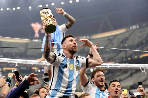 Victorious Lionel Messi with the Argentinian team. (Photo by Clive Brunskill/Getty Images)