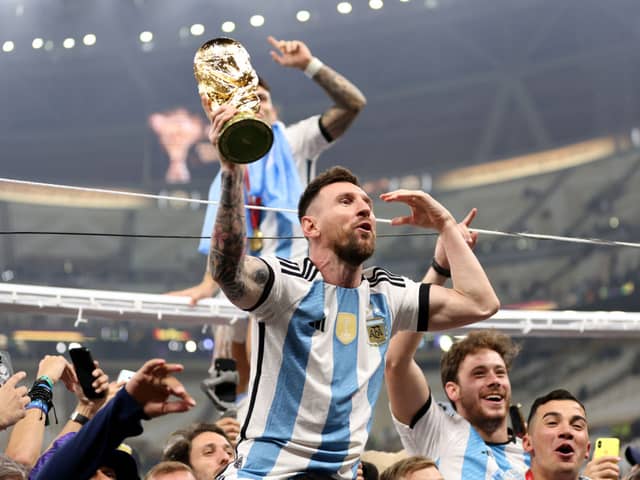 Victorious Lionel Messi with the Argentinian team. (Photo by Clive Brunskill/Getty Images)