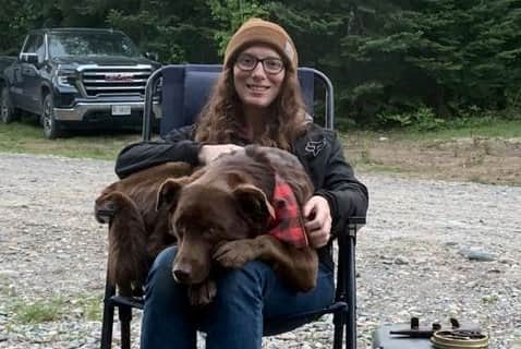 Chocolate Labrador and husky mix Lucy helps her owners Joshua Rheaume, aged 32, and Kelly O’Brien-Rheaume, age 30, to take care of their newborn baby girls. Lucy and Kelly are pictured.
