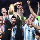 Lionel Messi of Argentina lifts the FIFA World Cup Qatar 2022 Winner’s Trophy. (Getty Images)