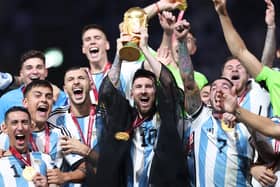 Lionel Messi of Argentina lifts the FIFA World Cup Qatar 2022 Winner’s Trophy. (Getty Images)