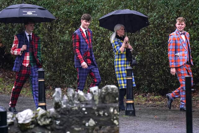 Weir's wife and sons wore colourful tartan to his funeral. (Credit: Getty Images)