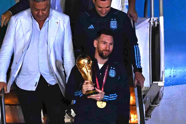 Lionel Messi touches down with World Cup trophy in Argentina