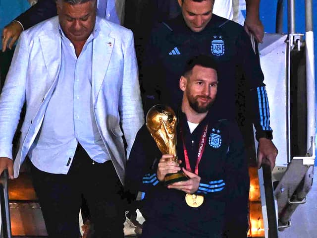 Lionel Messi touches down with World Cup trophy in Argentina