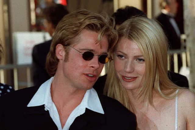 Actor Brad Pitt (L), nominee for best supporting actor for his role as " Jeffrey Goines" in "12 Monkeys" and his companion Gwyneph Paltrow (R) arrives at the Dorothy Chandler Pavillion in Los Angeles 25 March 1996 for the 68th annual Academy awards. This was Pitt's first nomination for an Oscar. AFP PHOTO Vince Bucci (Photo credit should read KIM KULISH/AFP via Getty Images)