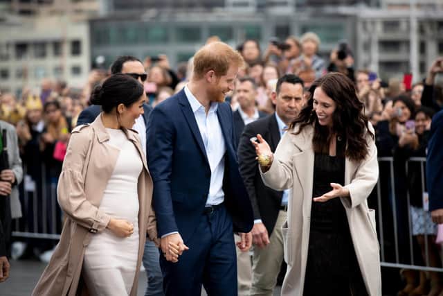 Jacinda Ardern with Meghan Markle and Prince Harry when they were doing a public walkaround along Auckland's Viaduct Habour in New Zealand in 2018.  (Photo by Dean Purcell - Pool/Getty Images)
