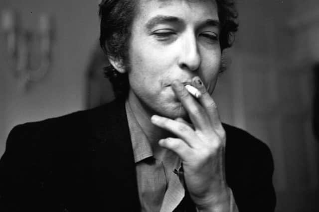 28th April 1965:  American electric folk hero Bob Dylan smoking a cigarette during a press interview.  (Photo by Evening Standard/Getty Images)