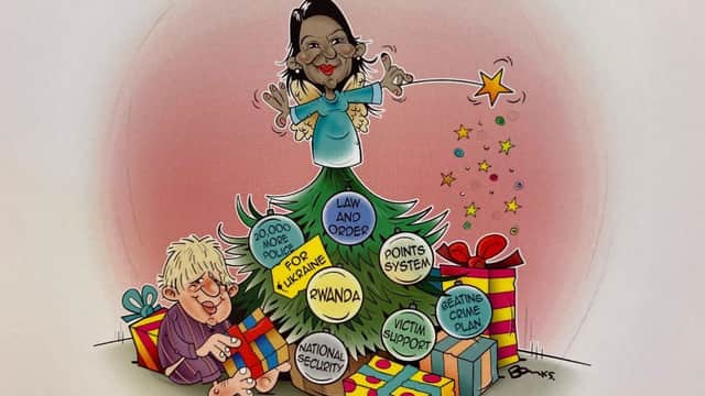 Priti Patel has been criticised for her Christmas card which depicts her as a fairy gifting her controversial Rwanda policy. (Credit: Twitter)