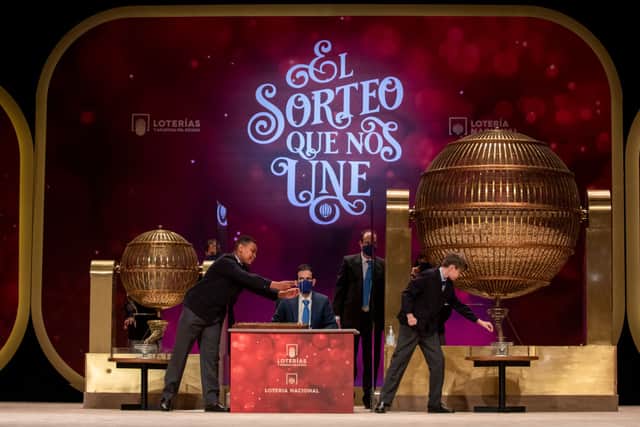 Pupils of the San Ildefonso school sing numbers during the draw of Spain’s Christmas lottery named ‘El Gordo’ (Fat One) at the Teatro Real on December 22, 2020 in Madrid, Spain (Photo by Pablo Blazquez Dominguez/Getty Images)