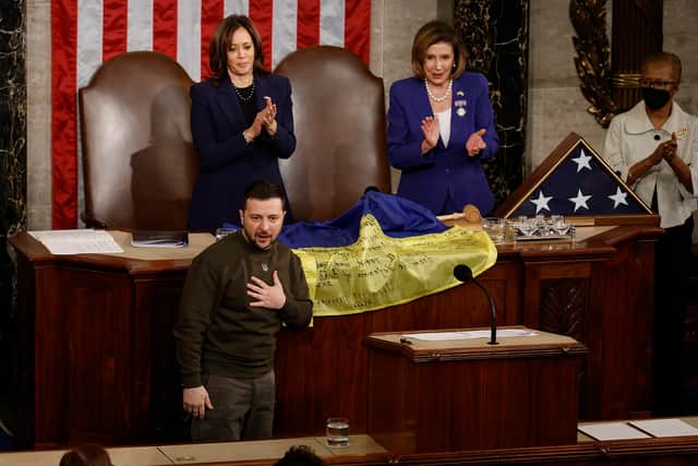 Volodymyr Zelensky thanks members of Congress after presenting a flag signed by members of the Ukrainian military to U.S. Speaker of the House Nancy Pelosi (D-CA) and Vice President Kamala Harris (Getty Images)