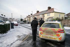 Police officers on Cornwallis Road, Dagenham, east London, where the the bodies of two boys, aged two and five were found. Credit: PA