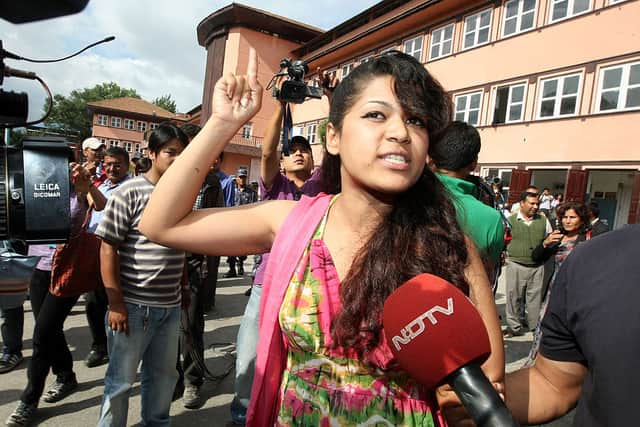 Nepali Nihita Biswas, 21, who reportedly married “Bikini Killer” Charles Sobhraj in prison two years ago, speaks with media outside the Supreme Court in Kathmandu on July 30, 2010 (Photo by PRAKASH MATHEMA/AFP via Getty Images)