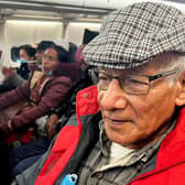 French serial killer Charles Sobhraj (C) sits in an aircraft departing from Kathmandu to France, on December 23, 2022, when he eas released from prison. (Photo by ATISH PATEL/AFP via Getty Images)