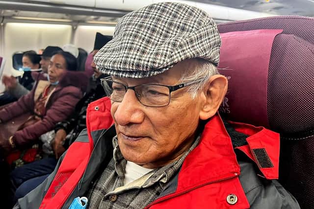 French serial killer Charles Sobhraj (C) sits in an aircraft departing from Kathmandu to France, on December 23, 2022, when he eas released from prison. (Photo by ATISH PATEL/AFP via Getty Images)