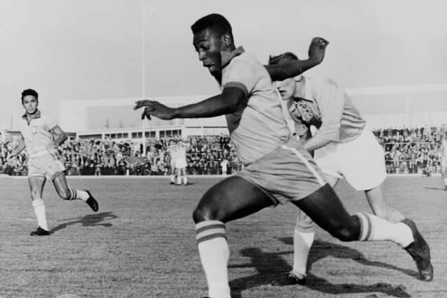 Pele dribbles past a defender during a friendly match between Malmoe and Brazil, on May 8, 1960 (Getty Images)