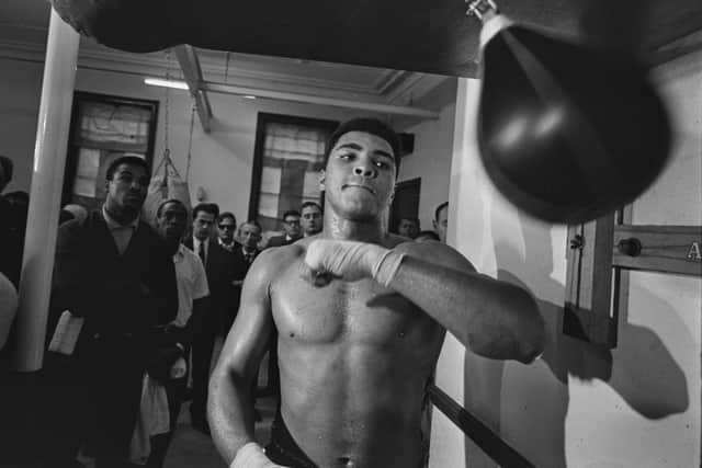American boxer Muhammad Ali (1942-2016) training with a speed bag ahead (R McPhedran/Daily Express/Hulton Archive/Getty Images))