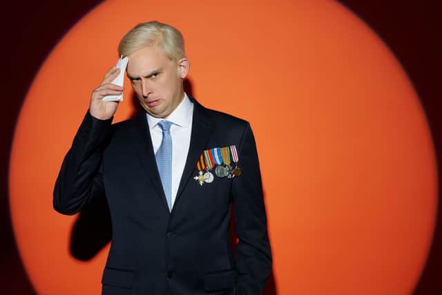 Kieran Hodgson as Prince Andrew, dabbing sweat from his forehead (Credit: Channel 4)
