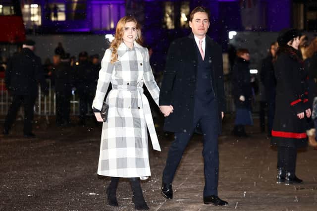 Princess Beatrice with husband Edoardo Mapelli Mozzi at the 'Together At Christmas Carol Service' at Westminster Abbey. (Photo by HENRY NICHOLLS/POOL/AFP via Getty Images)
