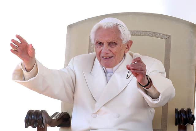 Pope Benedict XVI waves to the faithful gathered in St. Peter’s Square during his final general audience in February 2013 in Vatican City (Photo: Franco Origlia/Getty Images)