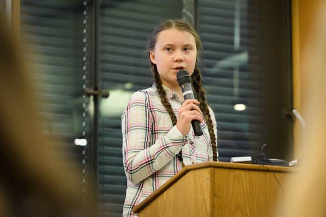 Swedish environmental campaigner Greta Thunberg addresses politicians, media and guests with the Houses of Parliament on April 23, 2019 in London, England (Photo by Leon Neal/Getty Images)