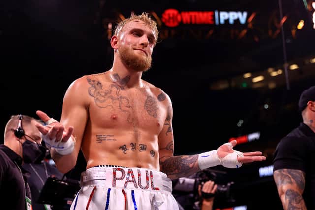 Jake Paul reacts to knocking out Tyron Woddley in the sixth round during an eight-round cruiserweight bout at the Amalie Arena on December 18, 2021 in Tampa, Florida. (Photo by Mike Ehrmann/Getty Images)