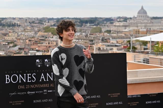 Timothee Chalamet wore a Vivienne Westwood jumper to a photo call for 'Bones and All' in Rome. (Photo by ANDREAS SOLARO/AFP via Getty Images)