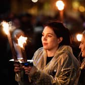 EDINBURGH, SCOTLAND - DECEMBER 30:  Members of the public take part during the torchlight procession as it makes its way through Edinburgh for the start of the Hogmanay celebrations on December 30, 2016 in Edinburgh, Scotland. It is expected to bring in 150,000 visitors from more than 80 countries to the city for the traditional New Year celebrations, which run over three days.  (Photo by Jeff J Mitchell/Getty Images)