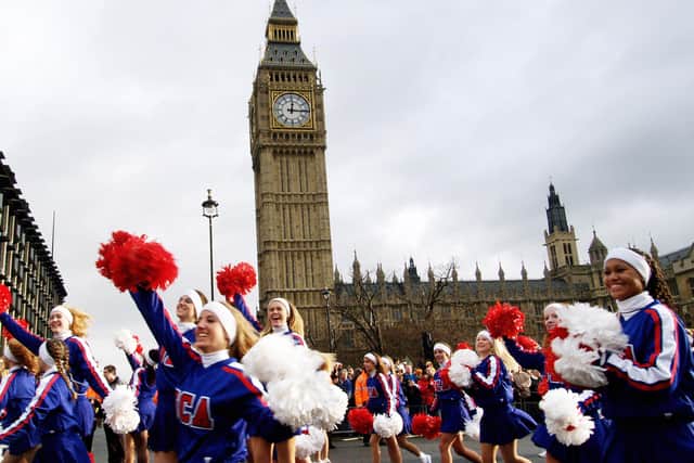  Members of the Universal Cheerleaders Association, UCA, from the United States, march past Big Ben, 01 January 2006 during the new year day parade in London. AFP PHOTO / Max Nash  (Photo credit should read MAX NASH/AFP via Getty Images)