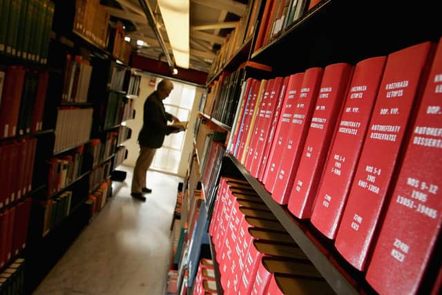  A man browses through books at the Cecil H. Green Library on the Stanford University Campus December 17, 2004 in Stanford, California (Credit: Justin Sullivan/Getty Images)