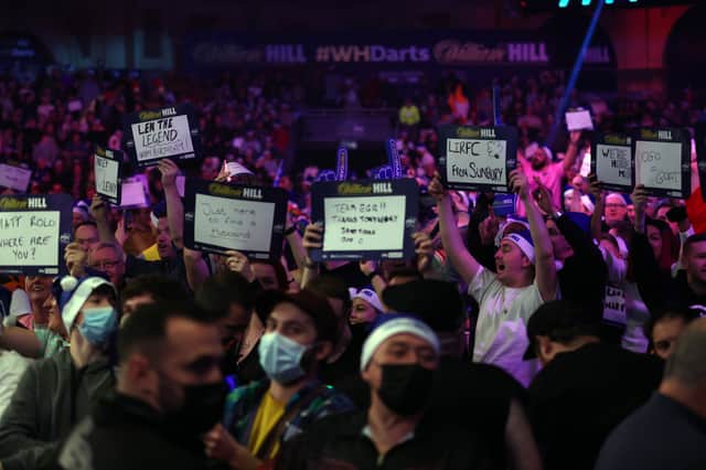 LONDON, ENGLAND - JANUARY 03: Fans enjoy the action during Day Sixteen of The William Hill World Darts Championship at Alexandra Palace on January 03, 2022 in London, England. (Photo by Luke Walker/Getty Images)