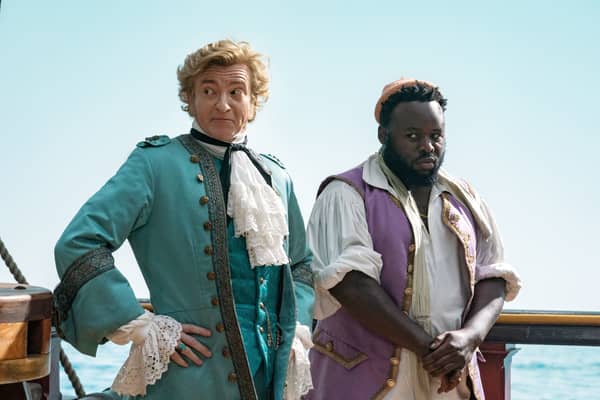 Rhys Darby as Stede Bonnet and Samson Kayo as Oluwande in Our Flag Means Death (Credit: BBC/Warner Bros. Entertainment Inc/Jake Giles Netter)